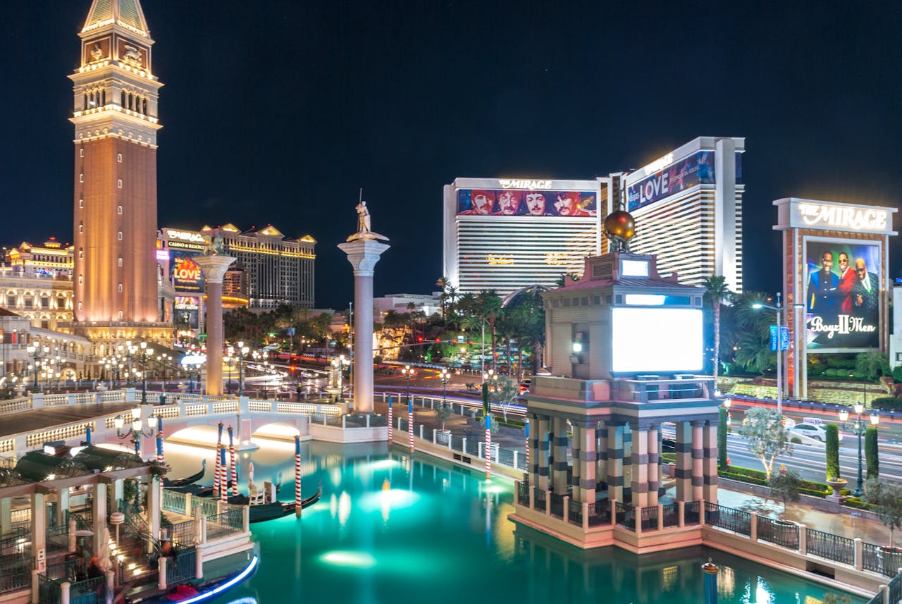 gallery-02 A stunning night view of Las Vegas Strip featuring illuminated landmarks and vibrant reflections.